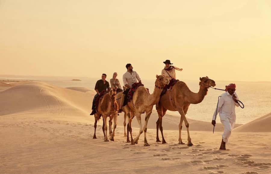 Doha: ATV Quad, Buggy Dune Bashing,Camel Ride & Sandboarding - Sandline Dunes stop: quad bike track time and dune-photo moments