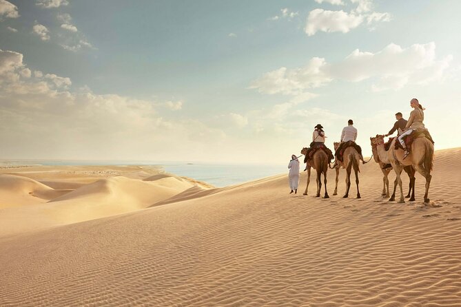 Doha Desert Safari Camel Ride, Sandboarding and Inland Sea - Sandboarding in Qatar’s desert: fast fun that works for most people