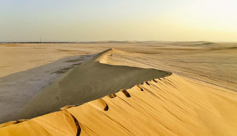 Doha: Desert Safari Dune Bashing, Sandboarding, & Camel Ride - Getting Out of Doha: Pickup, Road Time, and Mesaieed Views