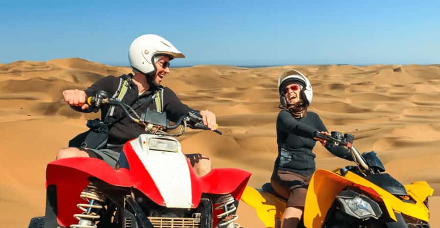 Doha: DesertSafari with Quad Bike, Camel Ride & Sandboarding - Camel ride and tea: a classic stop with practical charm