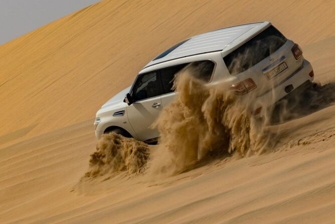 Doha Half Day Desert Safari Dune Bashing Camel Ride Sandboarding - Camel Stop and Bedouin Tea Moments Before the Sand