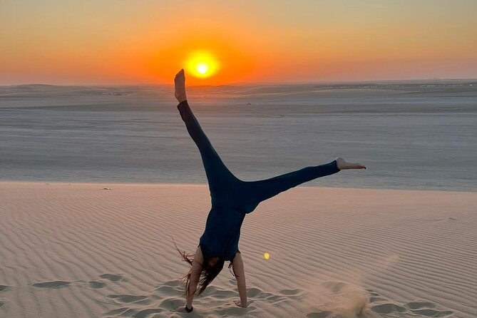 Doha Half Day Desert Safari Dune Bashing Camel Ride Sandboarding - Khor Al Udeid Beach: Inland Sea Views and Sandboarding