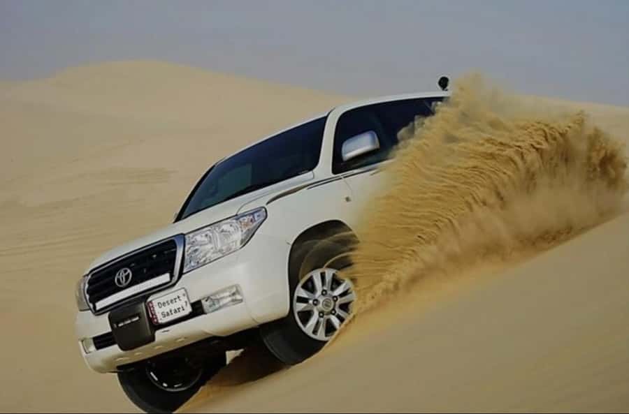 Doha: Half Day Desert Safari With Camel Ride & Sand Boarding - Mesaieed photo stop: tea, views, and a chance to add quad biking
