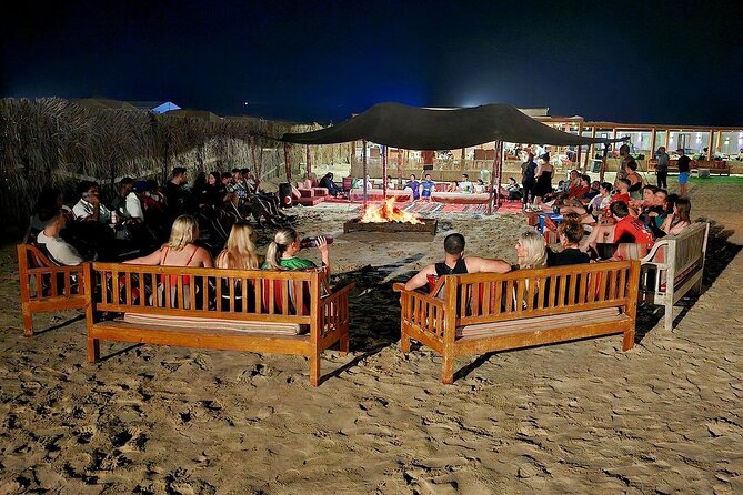 Doha Night Desert Safari Stargazing Dune Drive Camel Ride - Inland Sea Beach near the Saudi border: turquoise water with sand dunes