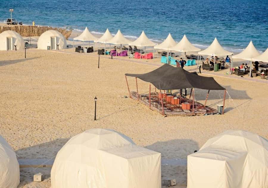 Doha: Overnight Desert Camping With BBQ Dinner & Breakfast - Sealine Beach Resort: Sandboarding and a Real Break from the Dunes