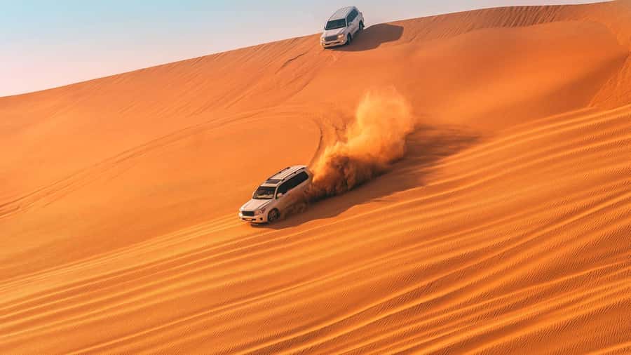 Doha : Private Desert Safari With Camel Ride & Sand Boarding - Khor al Adaid Inland Sea: The Saudi Border Sunset Moment