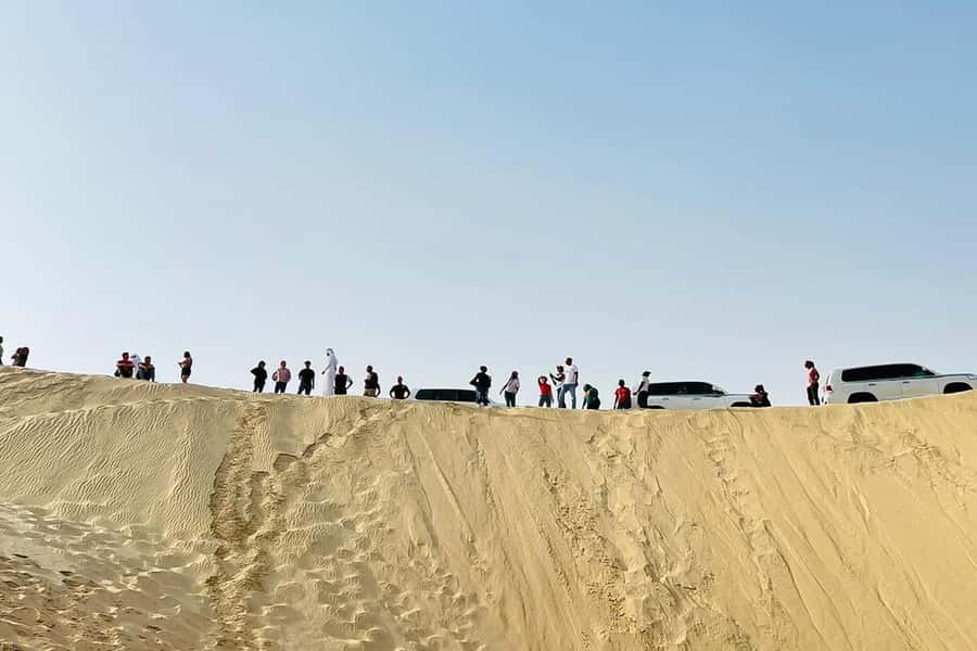 Doha Safari: ATV Ride, Dune Bashing, & Sandboarding Fun - Dune bashing at the Inland Sea: photo stops plus real thrills