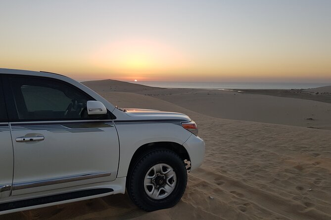 Doha: Sunrise /Sunset Desert Safari with Sand Boarding,Camel ride - The Best Photo Moments Are Built In