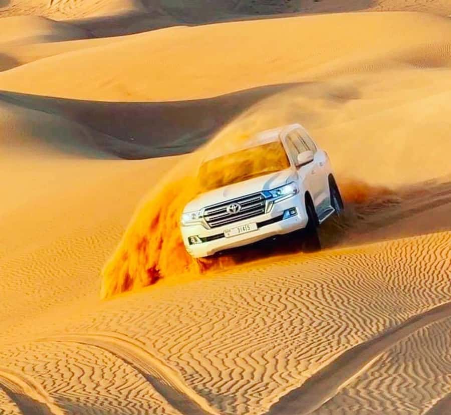 Doha: Sunset Desert Safari with Camel Ride & Sandboarding - Dune bashing: the adrenaline section you actually came for