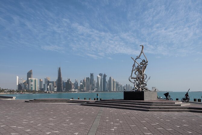 Explore Doha: City Tour & Dhow Boat Cruise Adventure - Corniche and West Bay photo stops, then the included dhow cruise