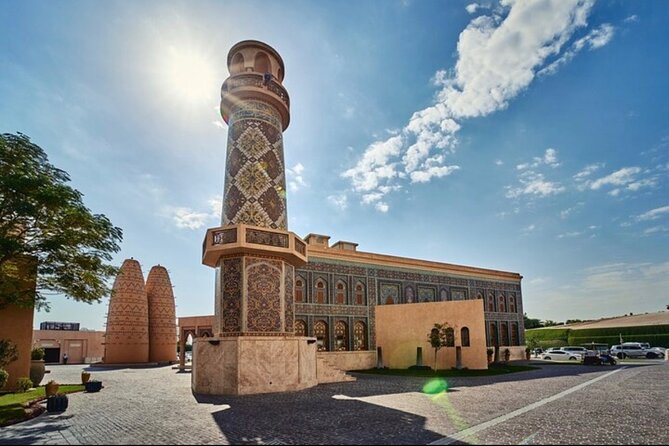 Explore Heart of Qatar Doha City Tour with Professional Guide - Souq Waqif: Spices, Shops, and Falcons by the Horse Stables