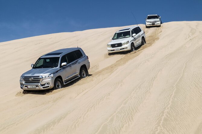 Private Full Day Desert Safari - The Desert Camp: Camel Riding, Sandboarding, and BBQ