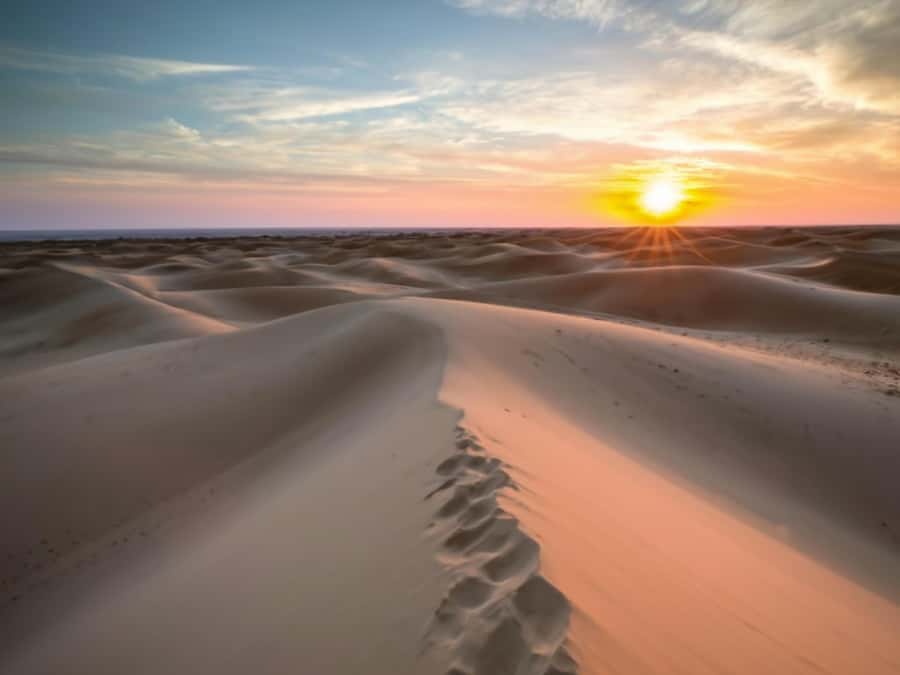 Qatar Desert Safari, Quad bike, Camel Ride and Sandboarding - Sunset mood over the Inland Sea and how to make it easy