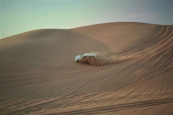 Qatar Sunset Desert Safari: Dune Bashing & Golden Sands Adventure - 4WD dune bashing and sandboarding: the adrenaline part that matters