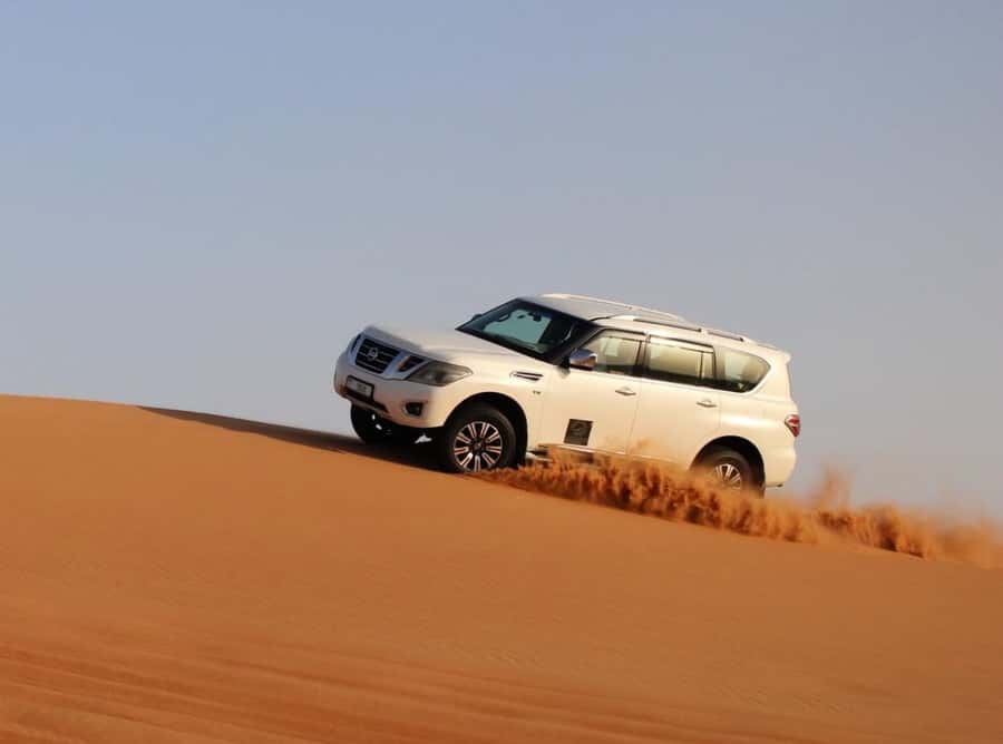 Qatar: Sunset Desert Safari with Camel Ride & Sandboarding - Dune bashing: the part where you hold on and listen