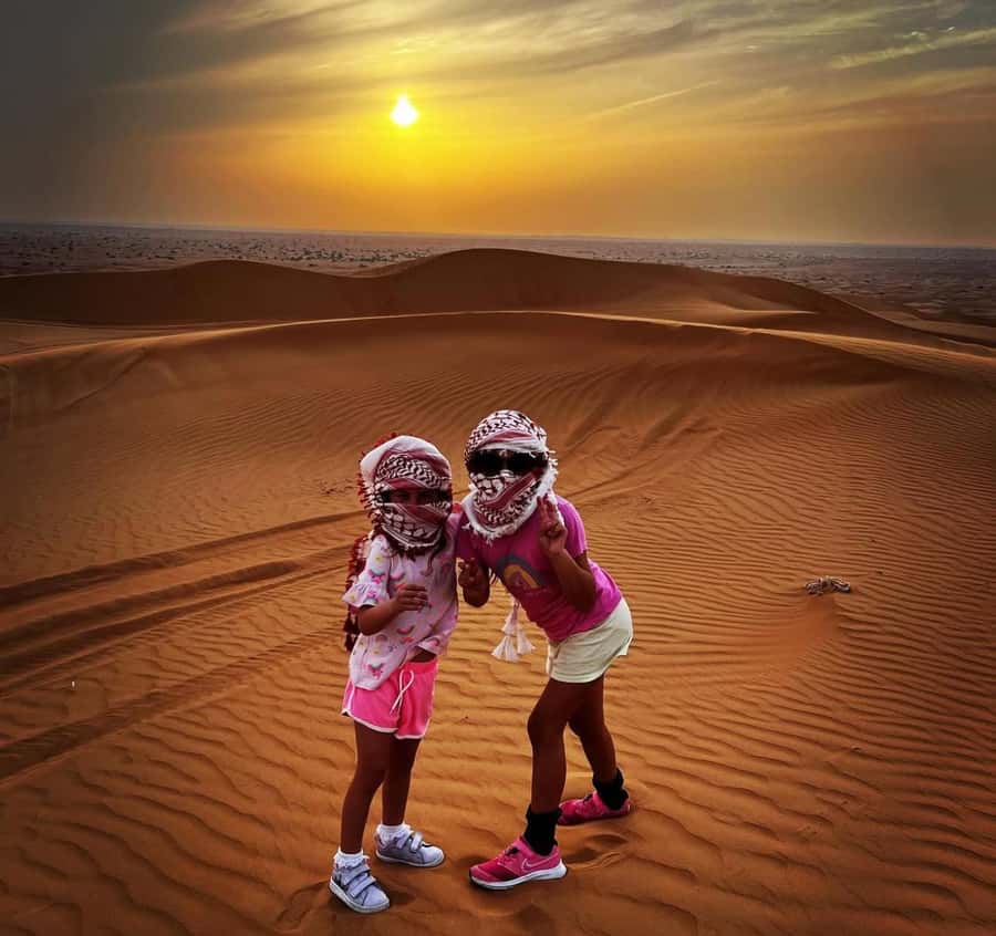 Qatar: Sunset Desert Safari with Camel Ride & Sandboarding - Sandboarding on real dunes, with help when you need it