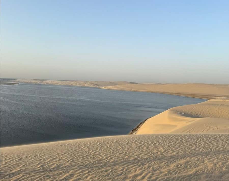 Sunrise/Sunset DuneBashing,CamelRide InlandSea &Sandboarding - Sunrise or sunset at the Inland Sea: where the colors really happen